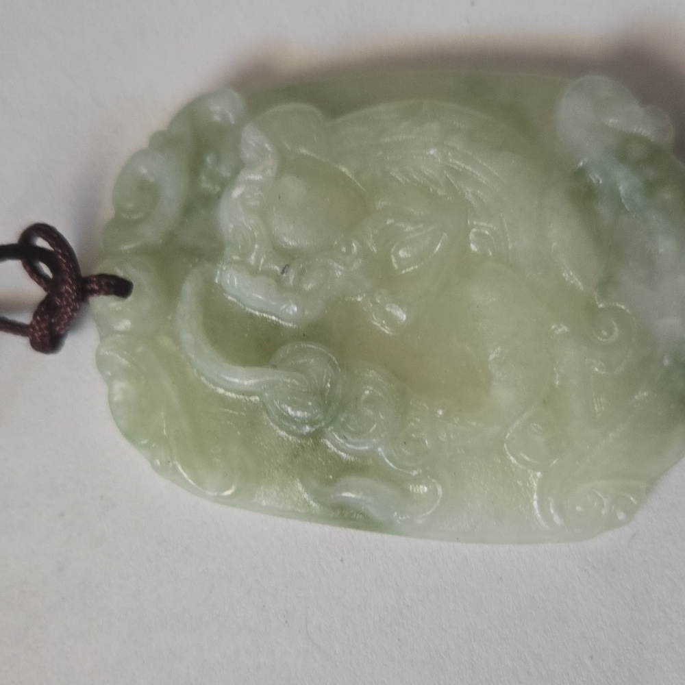 White jade foo dog pendant